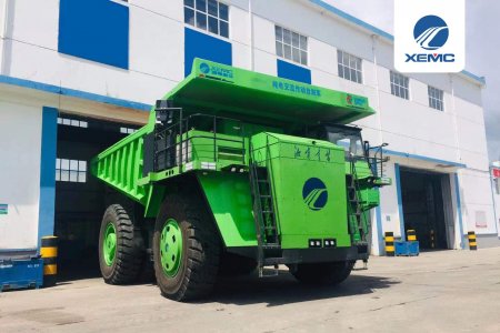 Huge electric dump truck goes to work at coal mine