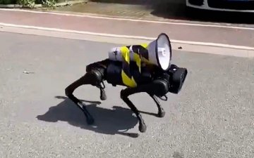 A ROBOT DOG ISSUING COVID-19 SAFETY INSTRUCTIONS IS ROAMING THE STREETS OF SHANGHAI